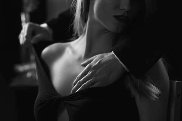 Man's hand resting on his partner's shoulder